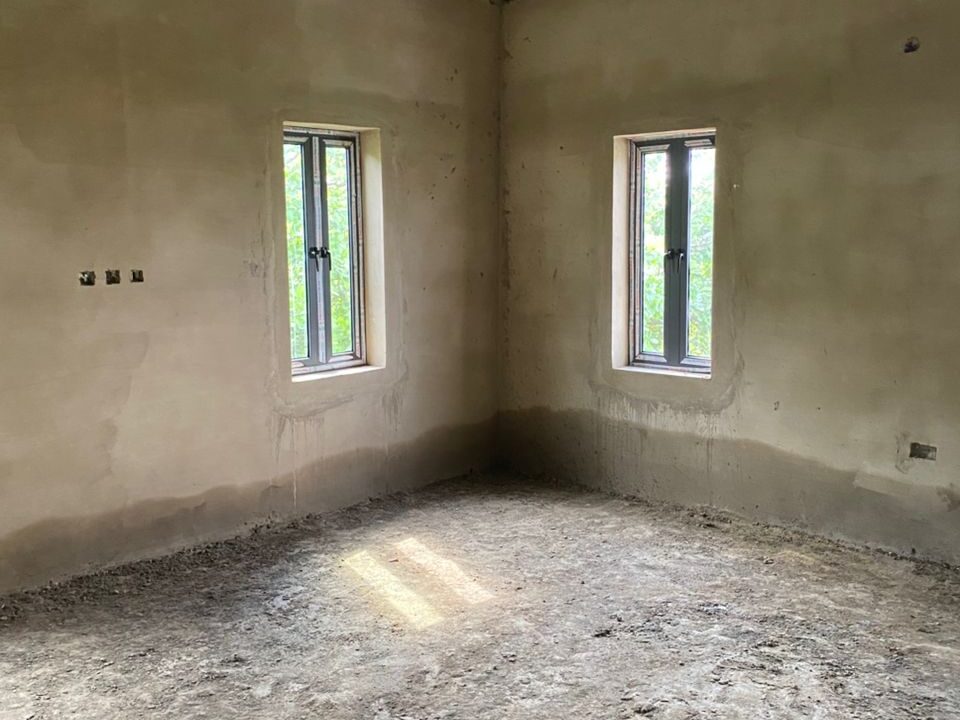 Interior of an Unfinished Room with Windows